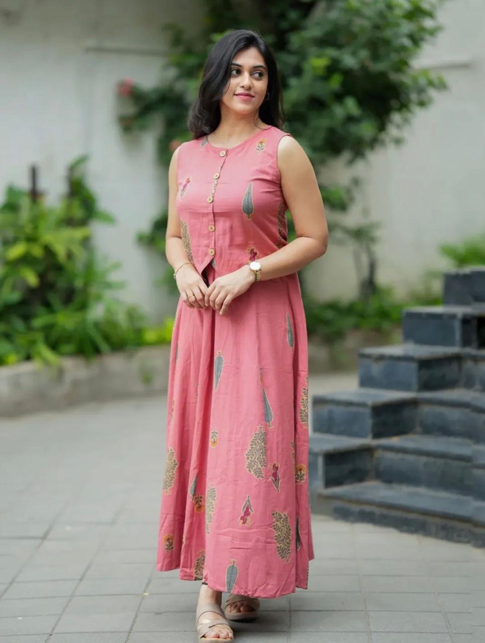 Roop contemporary ethnic co-ord set features a jacket-style sleeveless crop top paired with a gracefully flared maxi skirt.